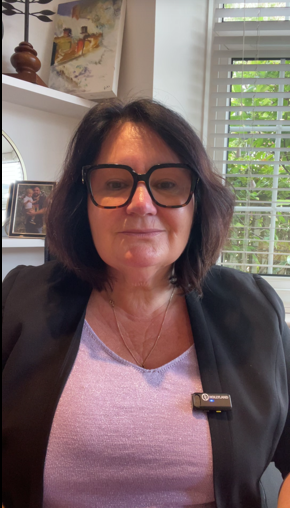 rofessional headshot of Niki Kerr, smiling warmly in a confident, approachable pose—used to represent her coaching and leadership brand.